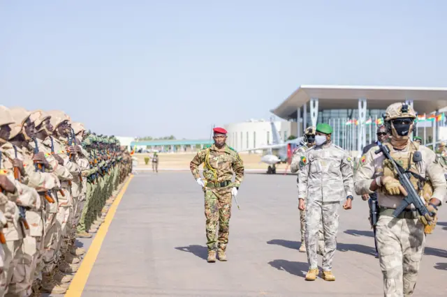 General Assimi Goita, transitional president of Mali, in military uniform reviewing troops