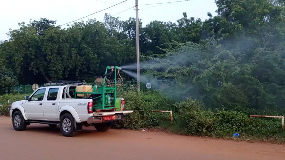 Health workers spraying mosquito repellent in Ouagadougou