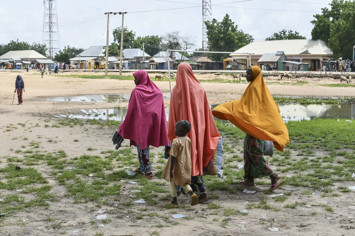 Survivors and relatives of victims of a suspected Boko Haram attack march in Babban Gide on September 4, 2024. At least 81 people died and several remain missing following a jihadist assault in the Yobe State of northeastern Nigeria, local officials reported.