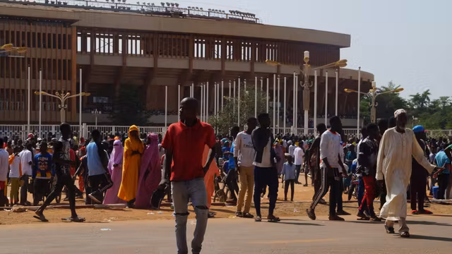 Nigeriens gathered near Niamey's General Seyni Kountché Stadium for civilian militia recruitment in August 2023