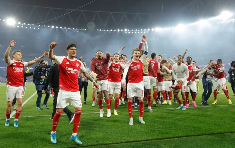 Arsenal players celebrating a goal Arsenal players celebrating a goal