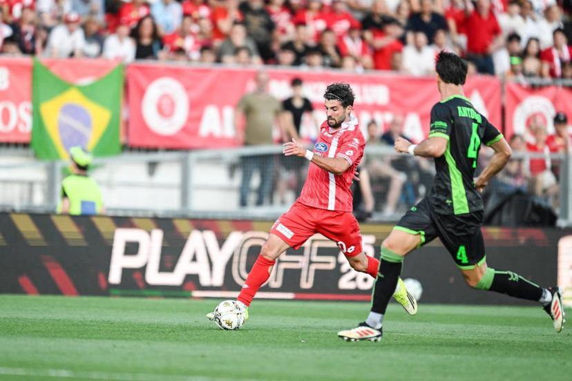 Patrick Cutrone and Monza players celebrate their Serie A promotion despite a tense play-off final against Catanzaro
