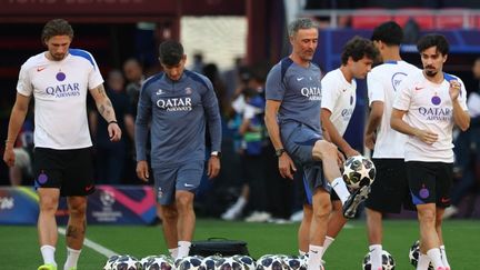 Luis Enrique surrounded by Paris Saint-Germain players ahead of the Champions League final at Puskás Arena, Budapest, May 30, 2026.