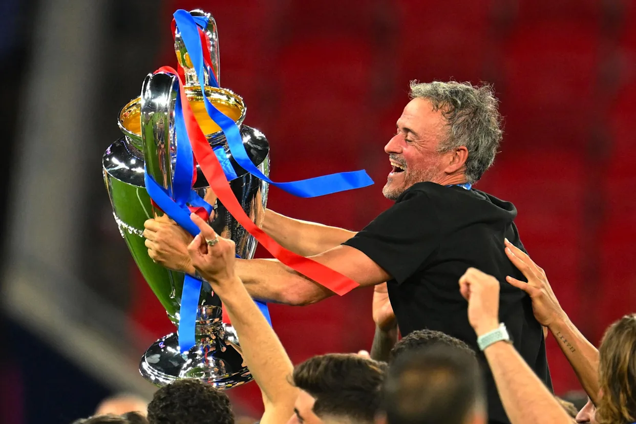 Paris Saint-Germain players and staff celebrate after winning the Champions League final