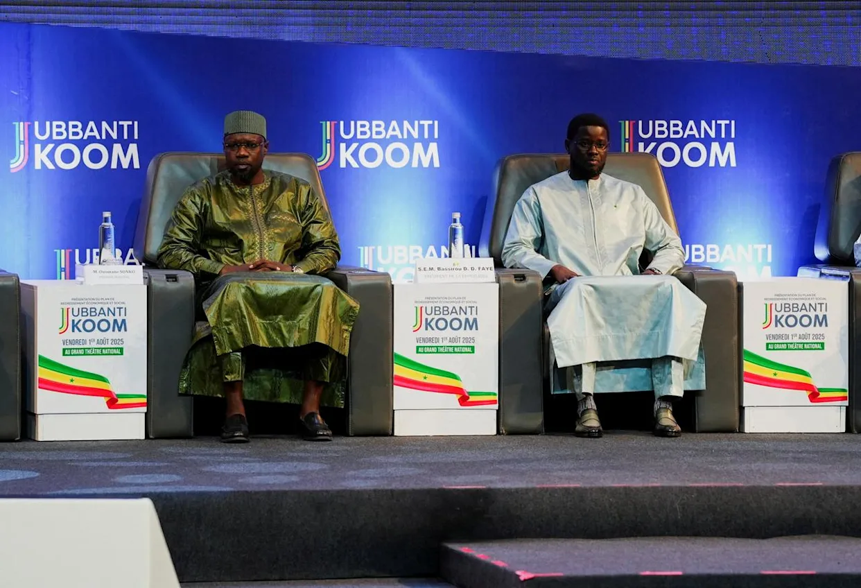 Senegal President Bassirou Diomaye Faye and former Prime Minister Ousmane Sonko shaking hands during a public event