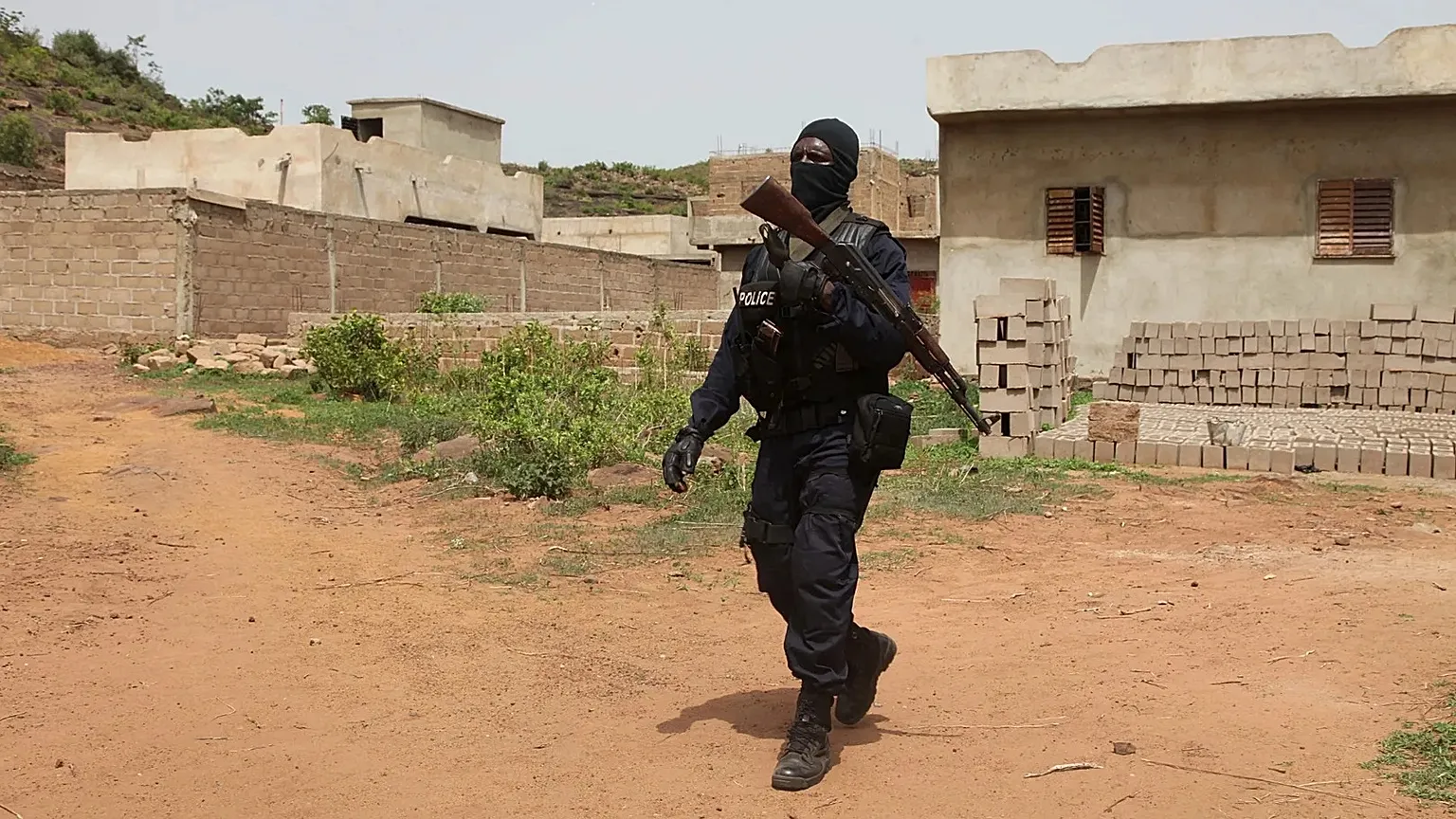Malian police officer patrols near Campement Kangaba tourist complex outside Bamako, June 19 2017