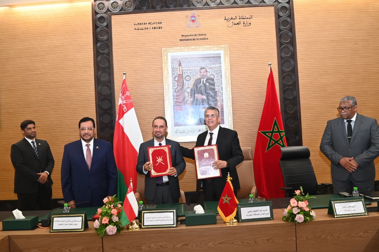 Morocco and Oman officials signing a judicial cooperation agreement