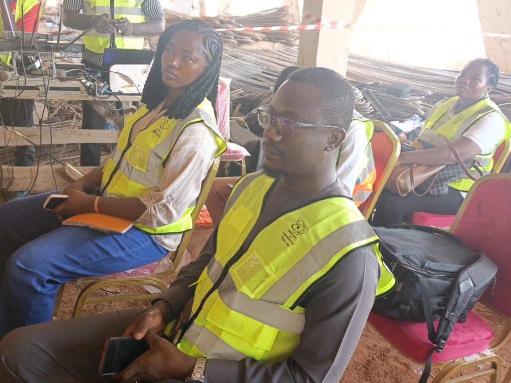 A professional gathering of civil engineers in Burkina Faso discussing infrastructure safety